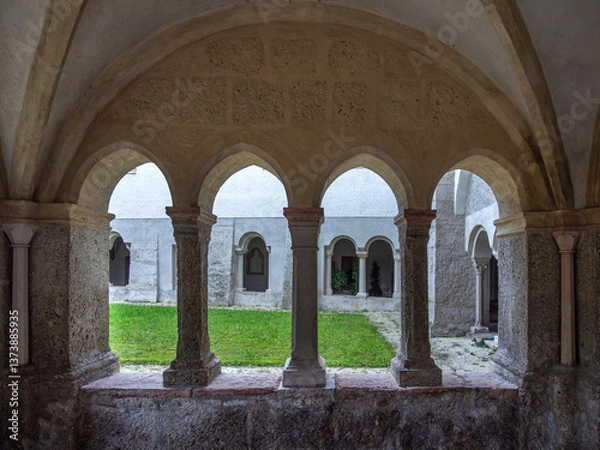 Fototapeta Medieval cloister corridor in Salzburg with stone arches, columns