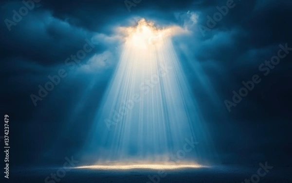 Fototapeta Bright, ethereal blue light beams shining through dark, heavy clouds, illuminating the ground below with a mystical, heavenly glow.
