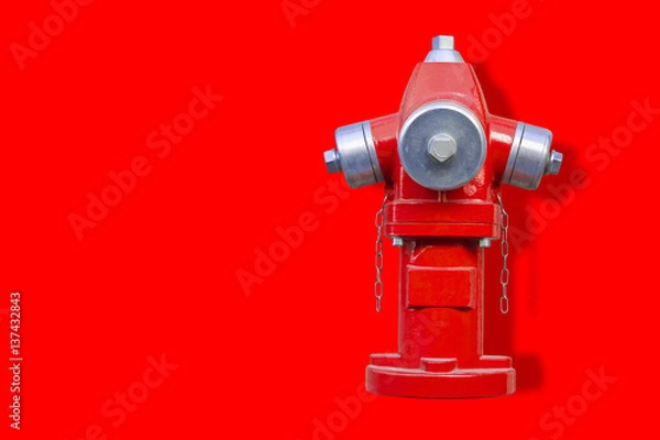 Fototapeta Red hydrant on red background - image with copy space