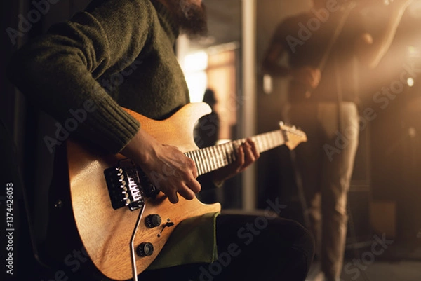 Fototapeta Guitarist play electric guitar, close up on hands. Music creativity, performance energy, indie rock atmosphere, teamwork.