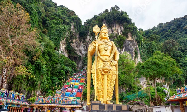 Obraz Statue of Lord Murugan and entrance at Batu Caves in Kuala Lumpur, Malaysia. Entrance to the cave complex with the Murugan statue in the front near Kuala Lumpur, Malaysia.