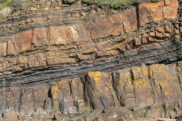 Fototapeta Rock strata on a cliff face. No people. Backgrounds.
