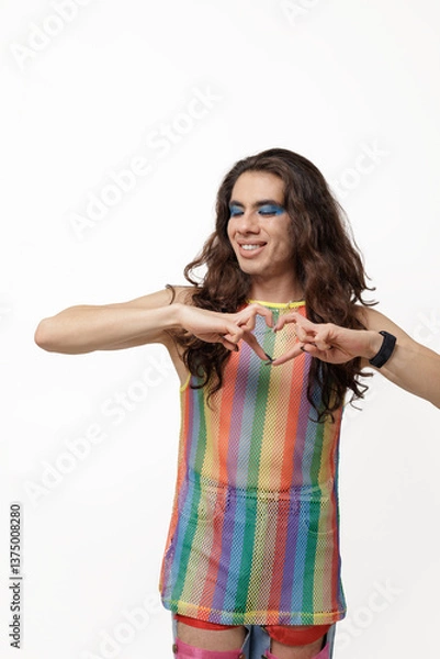 Obraz A non-gendered person poses with their fingers in a heart shape, supporting the Pride community.