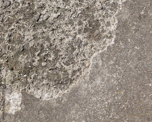 Fototapeta Background of destroyed concrete path, gray concrete, concrete texture, close-up. Natural photo. Old concrete slab