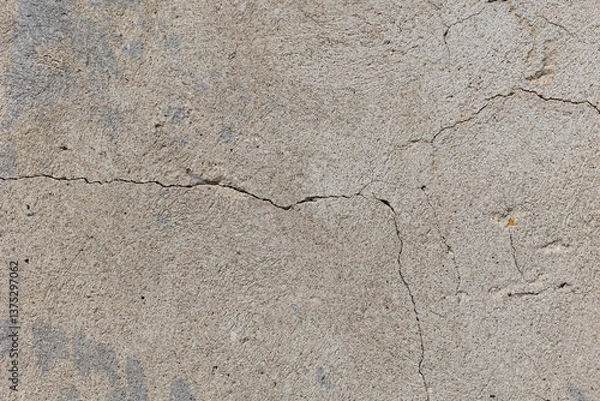 Fototapeta Background of destroyed concrete path, gray concrete, concrete texture, close-up. Natural photo. Old concrete slab