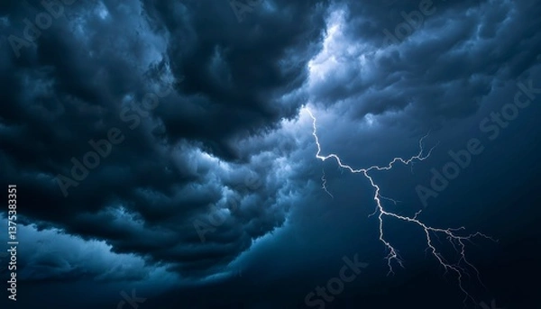 Fototapeta A summer thunderstorm with heavy rain gusty winds and flashes of lightning brightening the dark clouds. Fierce storm bright sky.