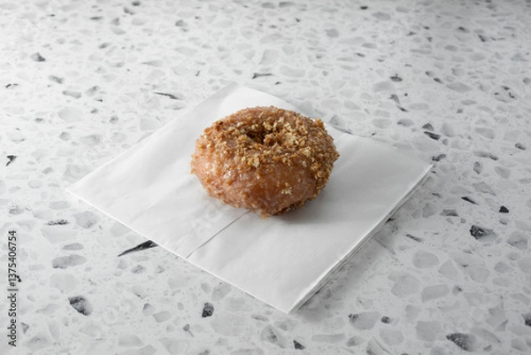 Fototapeta A view of a cinnamon crumb donut.