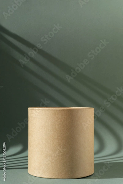 Obraz Brown round corrugated cardboard 3D -podium on green background with Light on wall. The concept mockup, Vertical image, frame