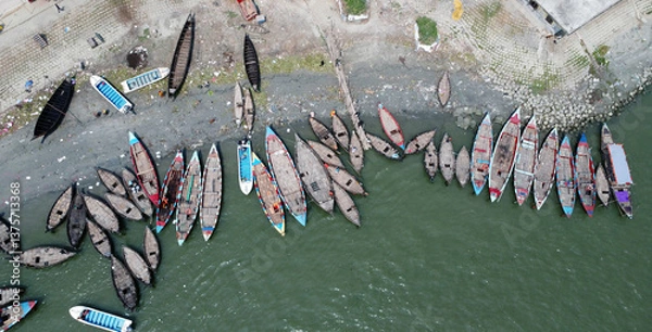 Obraz A bunch of human, transportion traditional and well decorated  fishing boat on the most highlighted and talked river Meghna. River side views  at  Chandpur ghat terminal, Bangladesh. 