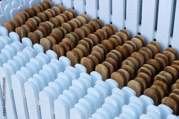 Fototapeta Wooden and White Decorative Pieces Arranged in a Neat Pattern