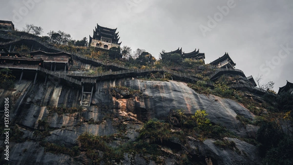 Obraz Wangxian Valley, 08 Dec 2024 China, Scenic mountain cliffside path view, surrounded by nature and forest. This travel destination features natural beauty remote village, and traditional architecture.