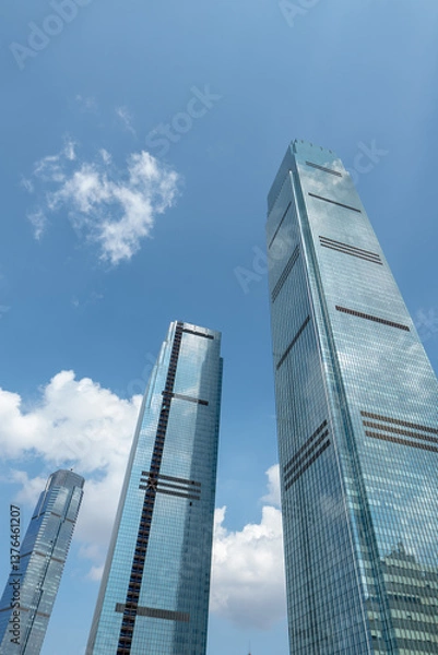 Fototapeta low angle view of modern skyscrapers and skyline.