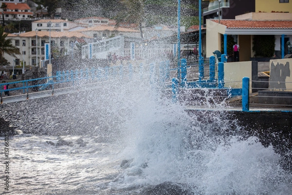 Fototapeta Ocean waves splashing on the shore of Madeira Island in Portugal
