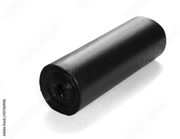Fototapeta  black roll of plastic garbage bags isolated on white