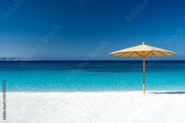Fototapeta Serene beach scene with blue ocean and bamboo parasol on white sand