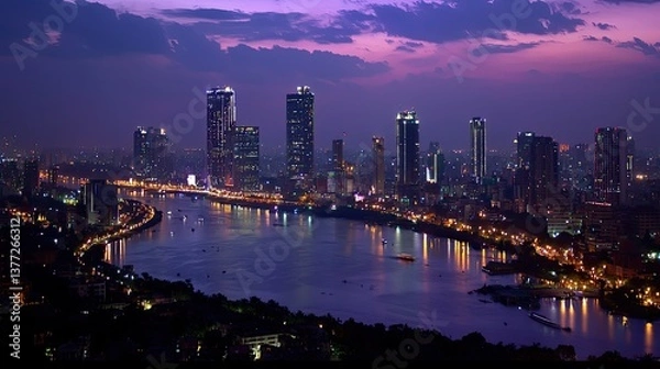 Obraz A breathtaking panoramic night view of Hyderabad, showcasing its modern skyline and historic landmarks glowing in city lights.