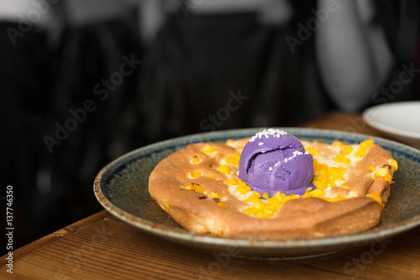 Fototapeta Mango Souffle Pancake Topped with Taro Ice Cream