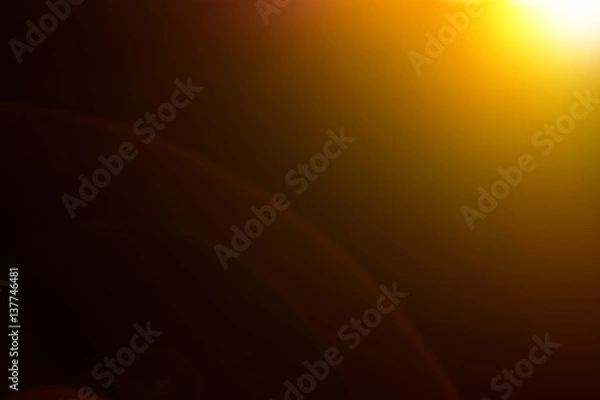 Fototapeta Lens flare and light beam on dark background yellow color style , photo from lens camera