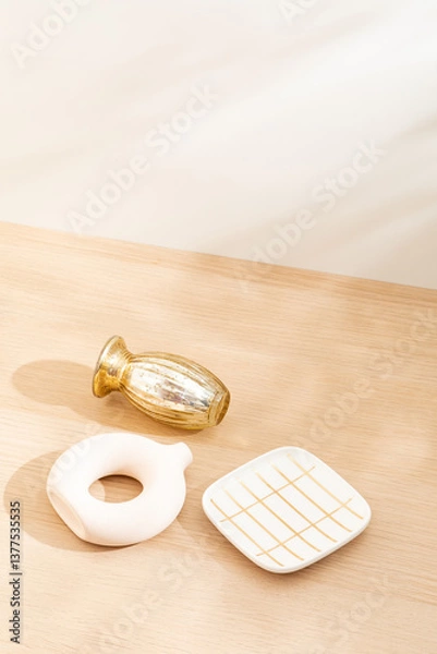 Obraz Copy space warm lighting background.Blank wallpaper with minimalist vase.Light and Shadow. Space for text.Backdrop.Studio photography.Sunshine. Chic style. Vase isolated on wooden. Home decor. Clean.