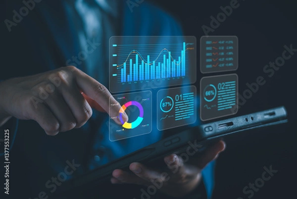 Obraz Analyzing Key Performance Indicators, Businessman using virtual screen to analyze key performance indicators KPI with various graphs and charts, showcasing data analysis and performance tracking