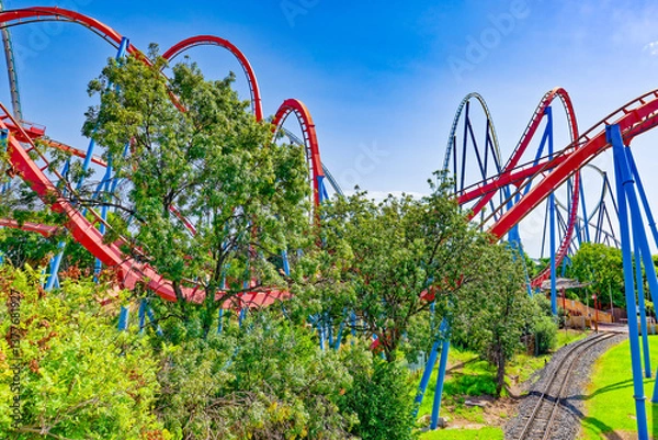 Obraz Roller Coaster in funny amusement park.