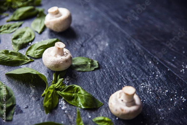 Fototapeta basil leaves on food background with mushrooms