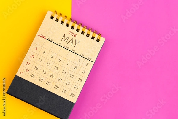 Fototapeta May 2026 desk calendar made from brown paper page on multicolor paper.