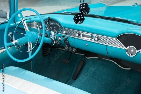 Fototapeta Interior shot of a blue colored 1956 convertible with fuzzy dice