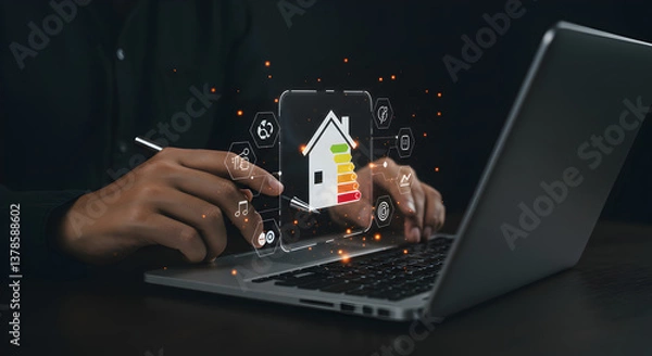 Fototapeta Person using laptop with house energy efficiency rating and icons overlayed on screen digitally