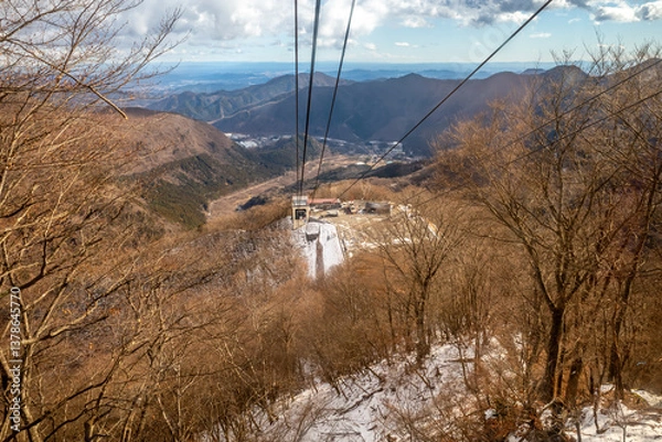 Fototapeta Akechidaira ropeway with surrounding beautiful viewpoints in Nikko, Japan, during cold weather in winter under cloudy blue sky