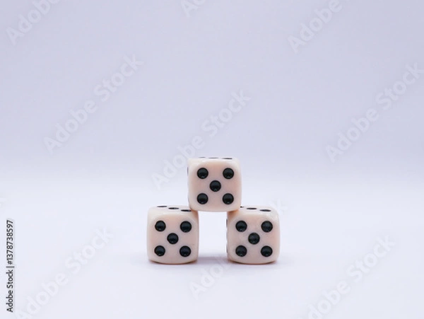 Fototapeta Three dice arranged in a pyramid, with a value of five, on a white background, front view, game, success, casino