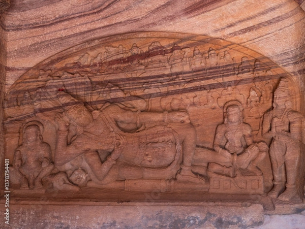 Fototapeta Amazing rock carving and sculptures at Badami ancient hindu temple complex, tourist destination in Karnataka, India
