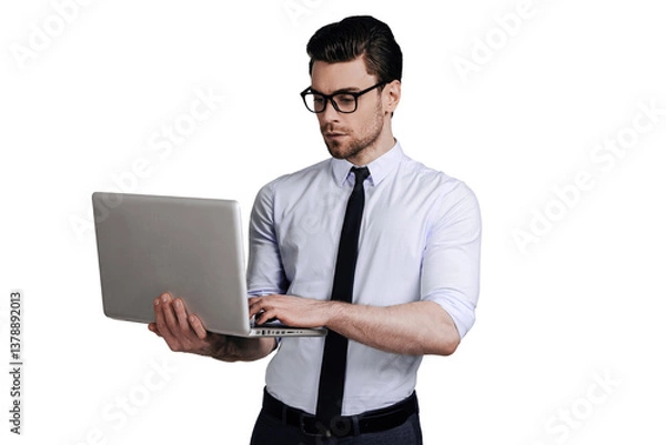 Fototapeta Man working on laptop while sitting at a table, isolated on transparent PNG background. Perfect for business, remote work, and professional design projects.

