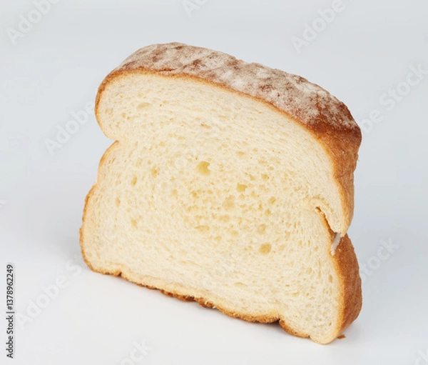 Fototapeta Freshly sliced white bread perfect for sandwiches or toast served on plain background