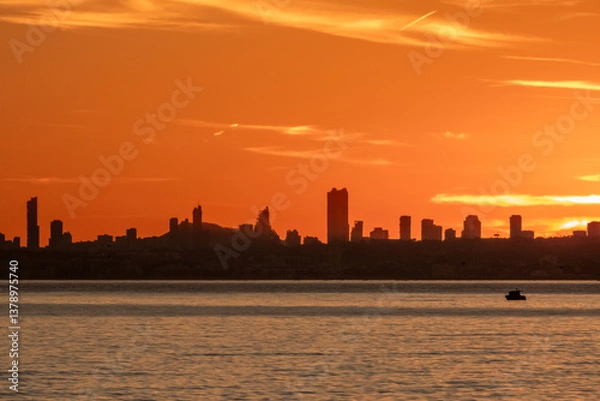 Fototapeta Sunset in December with a view of Benidorm. Spain, Calpe
