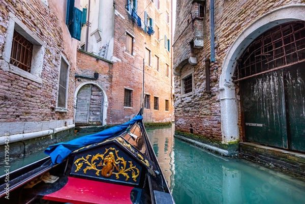 Obraz Gondola ride on a canal in Venice, Italy