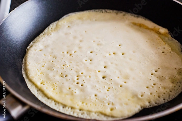 Fototapeta Making of home made pancakes