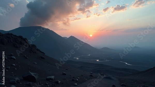 Obraz Desert valley with winding stream at sunset between silhouetted hills	