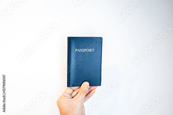 Fototapeta Passport close-up held in hand. generic passport with blank background