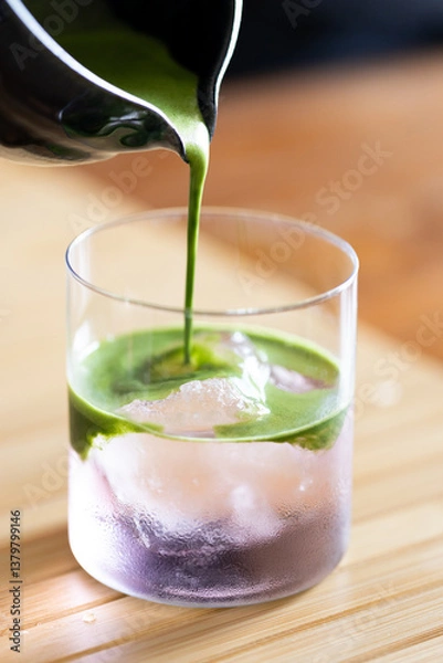 Obraz Iced matcha drink with coconut water.