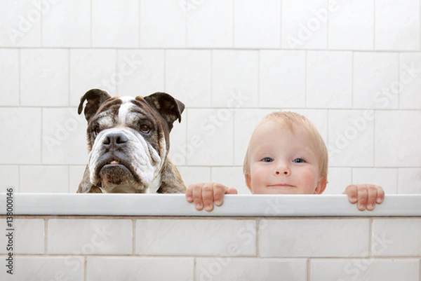 Obraz child and dog in the bathtub