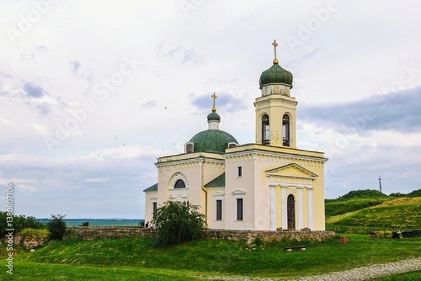 Fototapeta A modern stone church, shot from a wide angle. The photo is suitable for religious themes, architectural projects or travel guides.