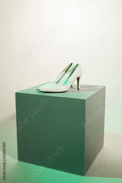 Obraz white high heel on a grey box