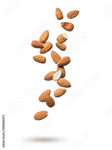 Obraz Shelled almonds floating isolated on white background.