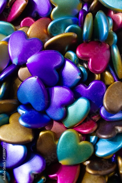 Fototapeta Colorful heart shaped beads background. Valentine's Day celebration