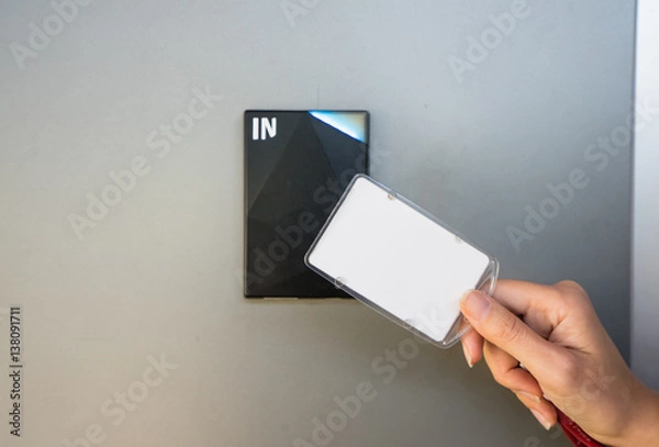 Obraz Asian business man hand holding Access card / Key Card eletronic door accessing control scanning to lock and unlock door. Security scan door open / close Automatic Technology system concept