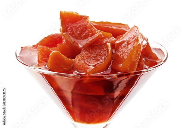 Fototapeta Sweet quince jam in glass dish isolated on white background