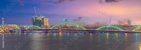 Obraz Fire Breathing Dragon Bridge at Da Nang over a river, wonderful colours of the Sky at night and river in Da Nang Vietnam. thousands of spectators line up on Saturday and Sunday night 