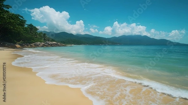Fototapeta Peaceful Beach with Calm Ocean Waves and Soft Sandy Shores
