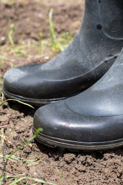 Obraz Black Rubber Boots in Mud